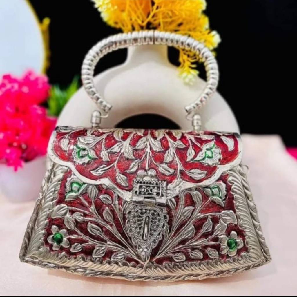 Silver Plated Brass Clutch with Intricate Designs and Vibrant Meenakari Work | Red Base with Silver and Green Vine Detailing | Trapezium-Shaped Clutch Bag with Attached Chain and Handle | for Women